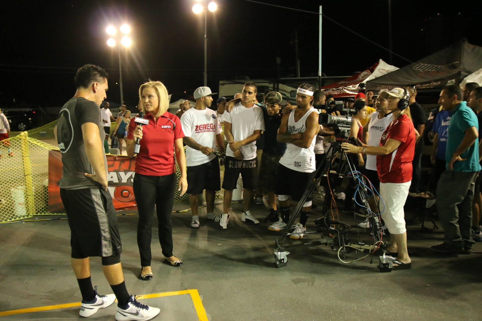 Molly Gomez conducting an ESPN interview on location with a camera crew